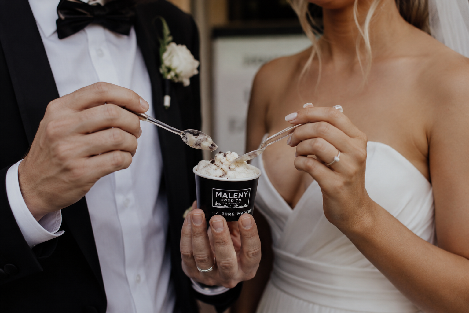 Bride and groom sharing a cup of Maleny gelato at their wedding